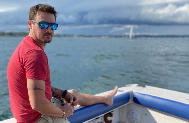 Me on my Grady White watching some weather roll in.